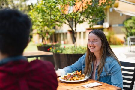 Trinity student eating a meal